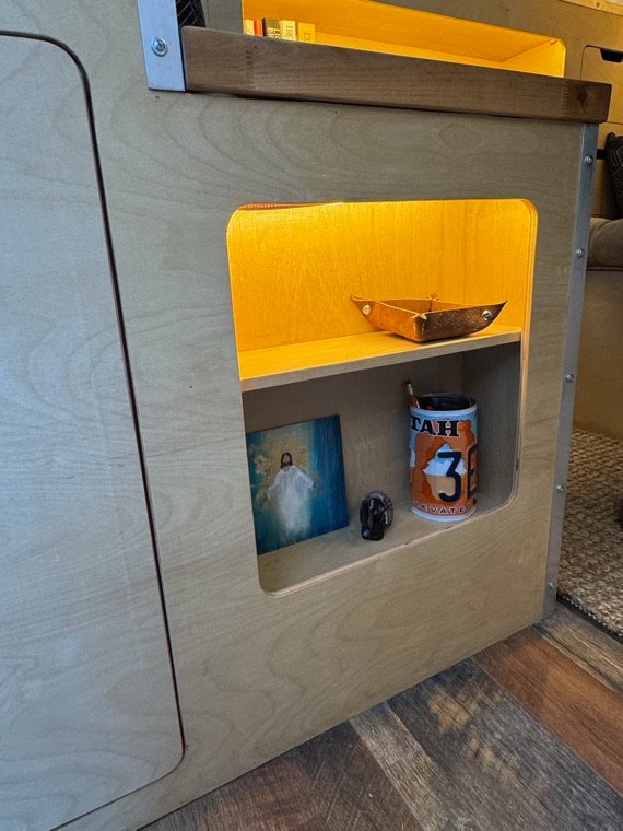 Built-in shelving with accent lighting