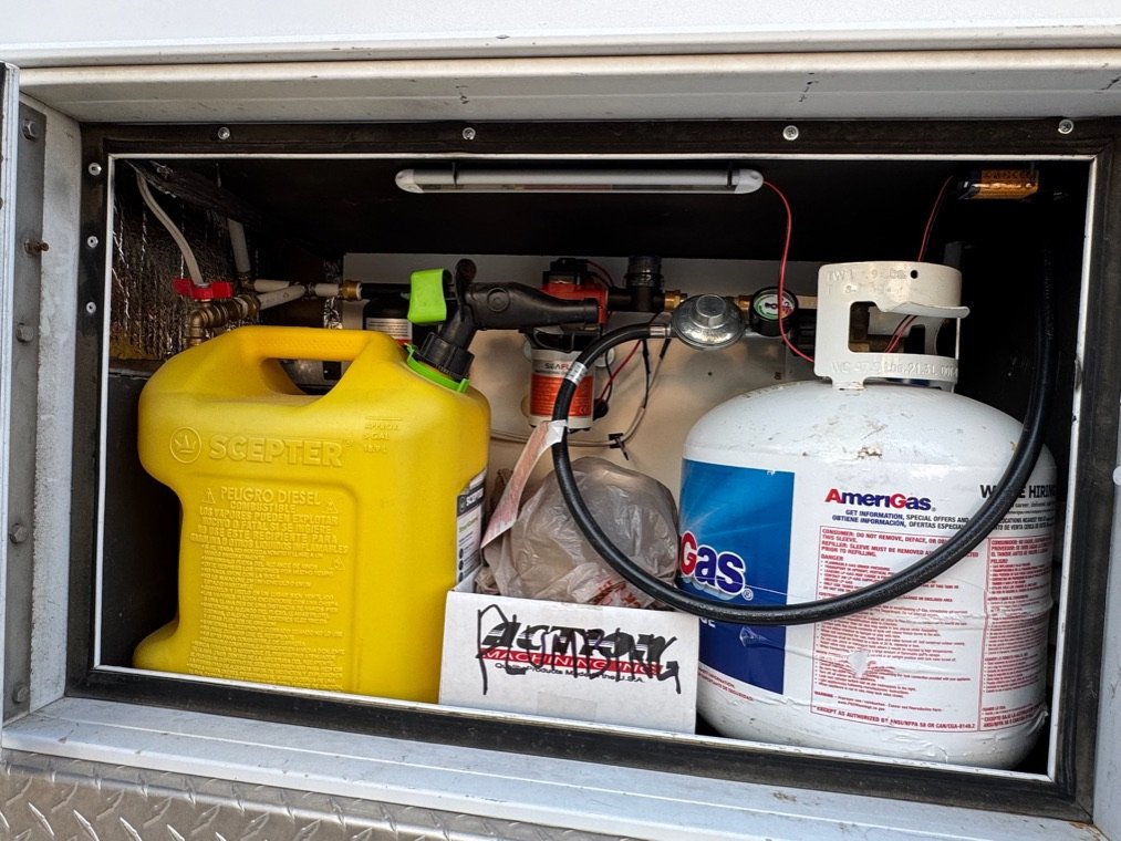 Exterior compartment with fuel and propane storage